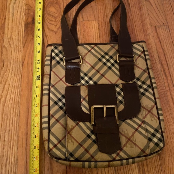 Burberry purse with browns leather straps and snap front with opening - Picture 1 of 13